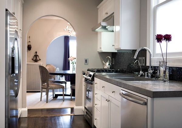 Small-kitchen-with-taupe-wall-dark-floors-gray-counters-and-white-cabinets